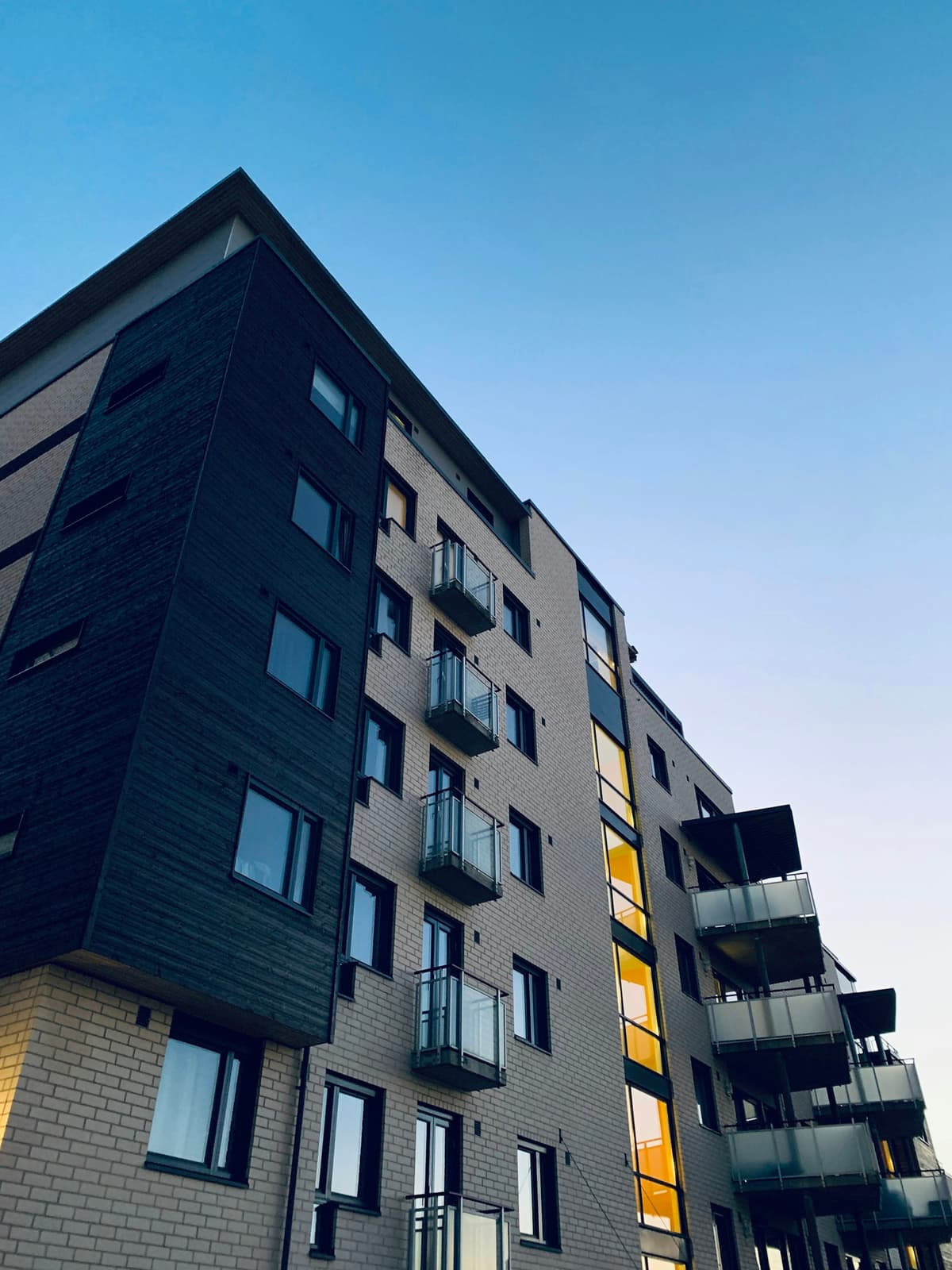 A brick apartment building (placeholder photography; real BPG buildings to follow)